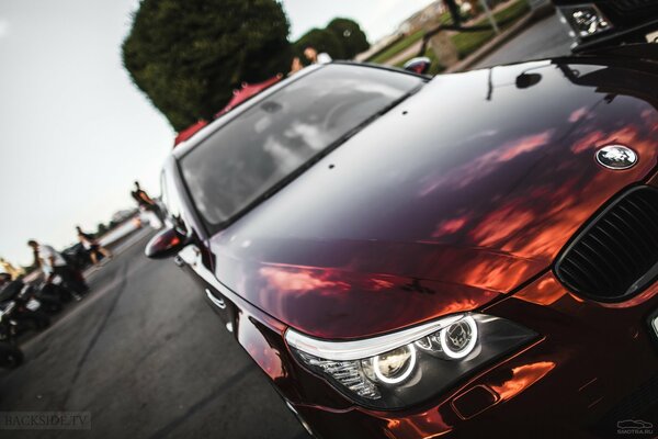 Red bmw e60 in mirror film