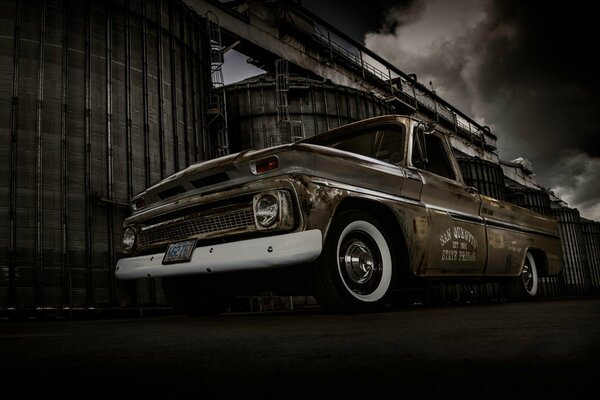 Gloomy pickup truck under the railway station