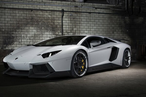 White lamborghini on a brick wall background