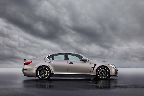 Silver lexus ls tmg against the sky