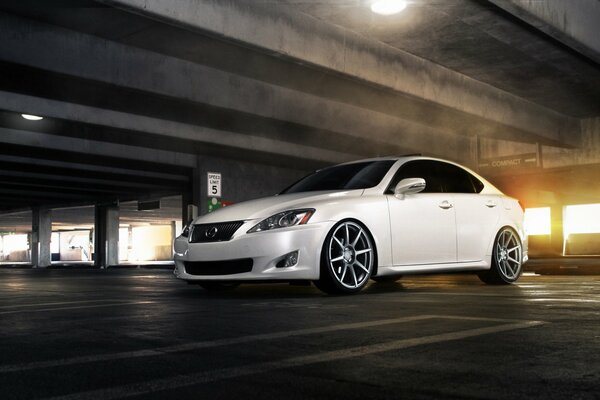 White Lexus car in the underground parking lot