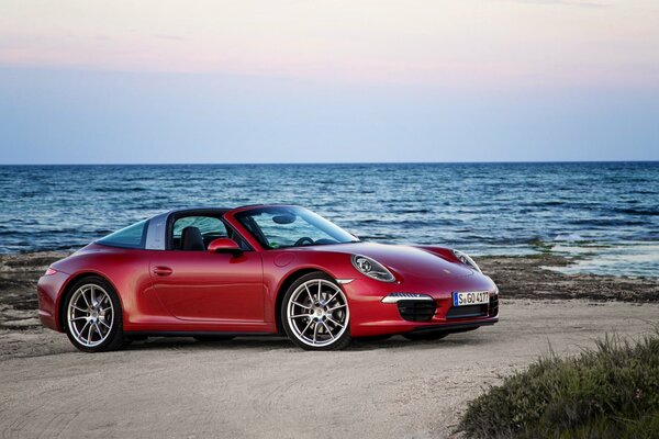 Red porsche, 911 2014 on the coast