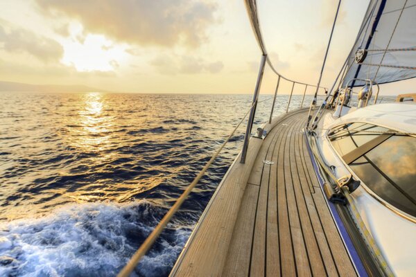 Sailing yacht on the background of a beautiful sunset