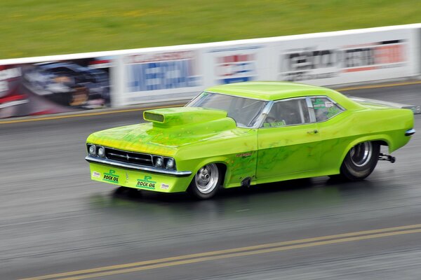 Muscle car participates in drag racing