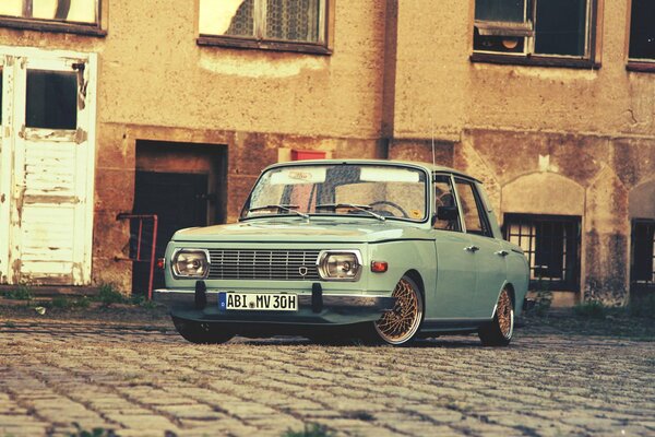 Old classics on a cobblestone road