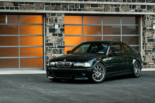 Bmw e46 on the background of orange windows