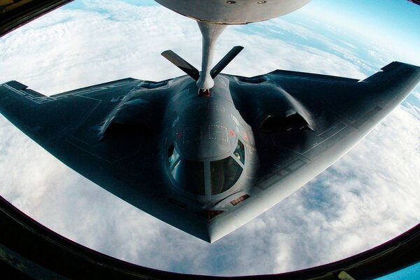 REFUELING A BOMBER IN THE SKIES OF AMERICA