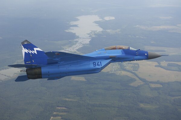 Blue mig - 29kub flies over the field