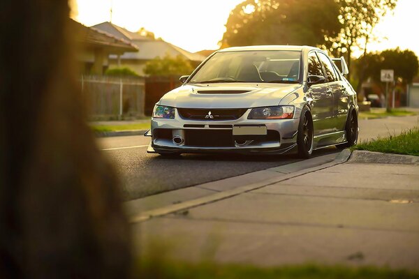 Mitsubishi light front on a background of bright light