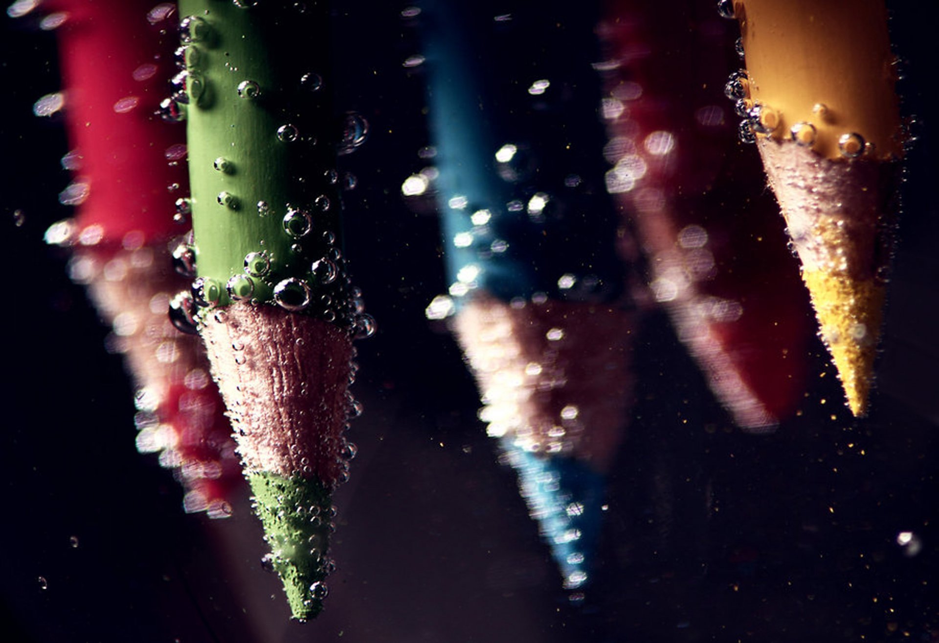 pencils under water bubbles bubbles under water water macro color