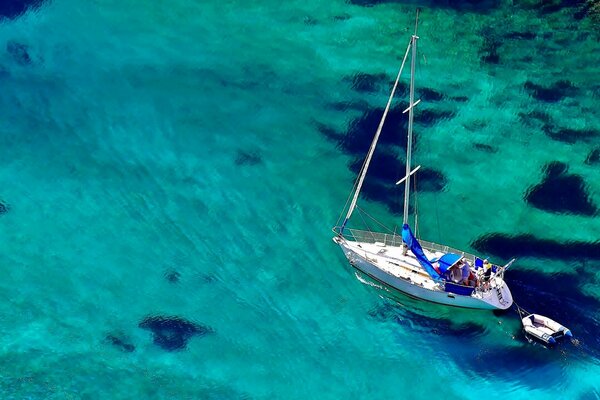 The yacht is sailing on blue water