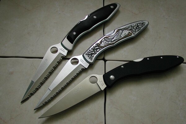 Three knives with different handles and blades