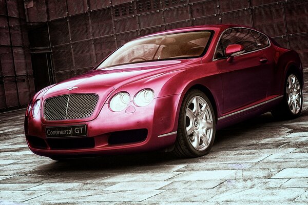 Red continental Bentley on the wall background