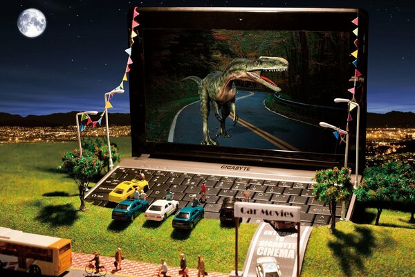 Miniatura del cinema con grande giocabile su cui il dinosauro funziona