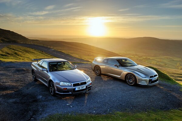 Silver Nissan gtr in the mountains at sunset