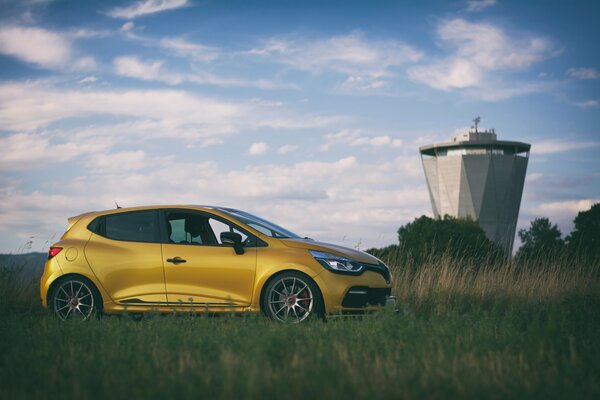 Yellow Renault Clio in the field