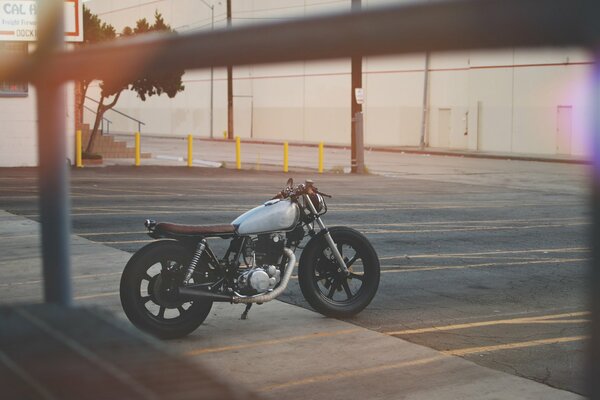 A yamaha motorcycle is parked on a marked road