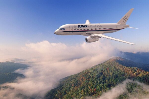 A plane flying in the clouds is preparing to land