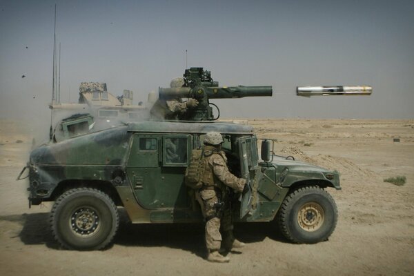 Military equipment - a hummer car and a rocket with a soldier