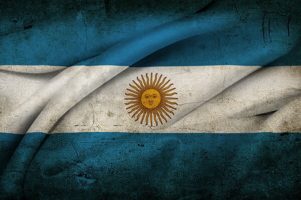 The sun on the flag of Argentina with folds