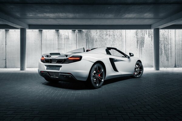 White McLaren in the cargo compartment