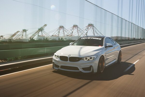 Bmw rushes along the motorway at high speed