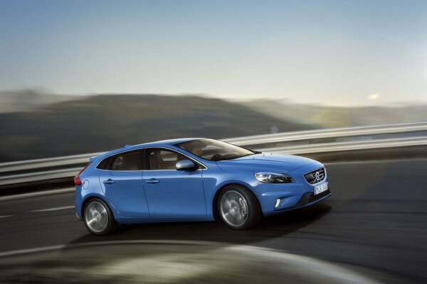 Painting of a blue volvo car, v40, r-design