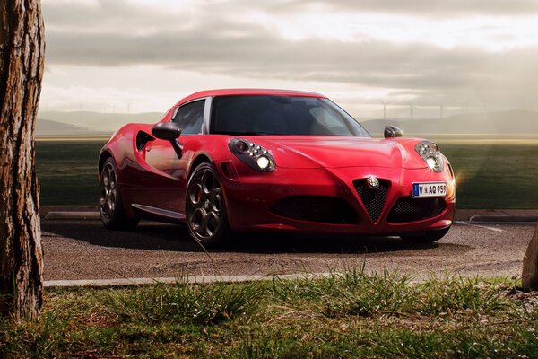 Red Alfa Romeo 2015 under the rays of the sun