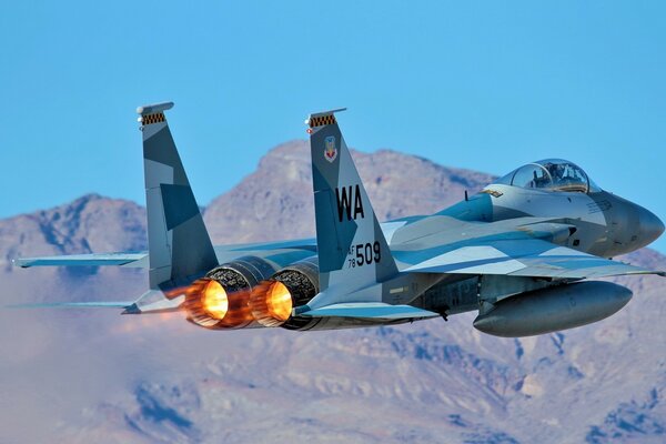 Military aircraft on the background of mountains