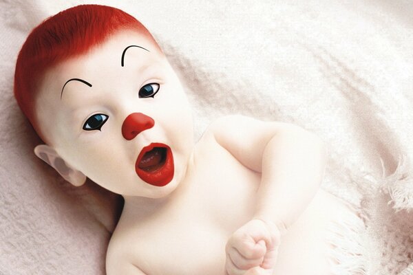 The child is made up in the form of a clown with red hair