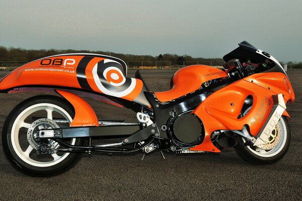 Suzuki s orange motorcycle on the track