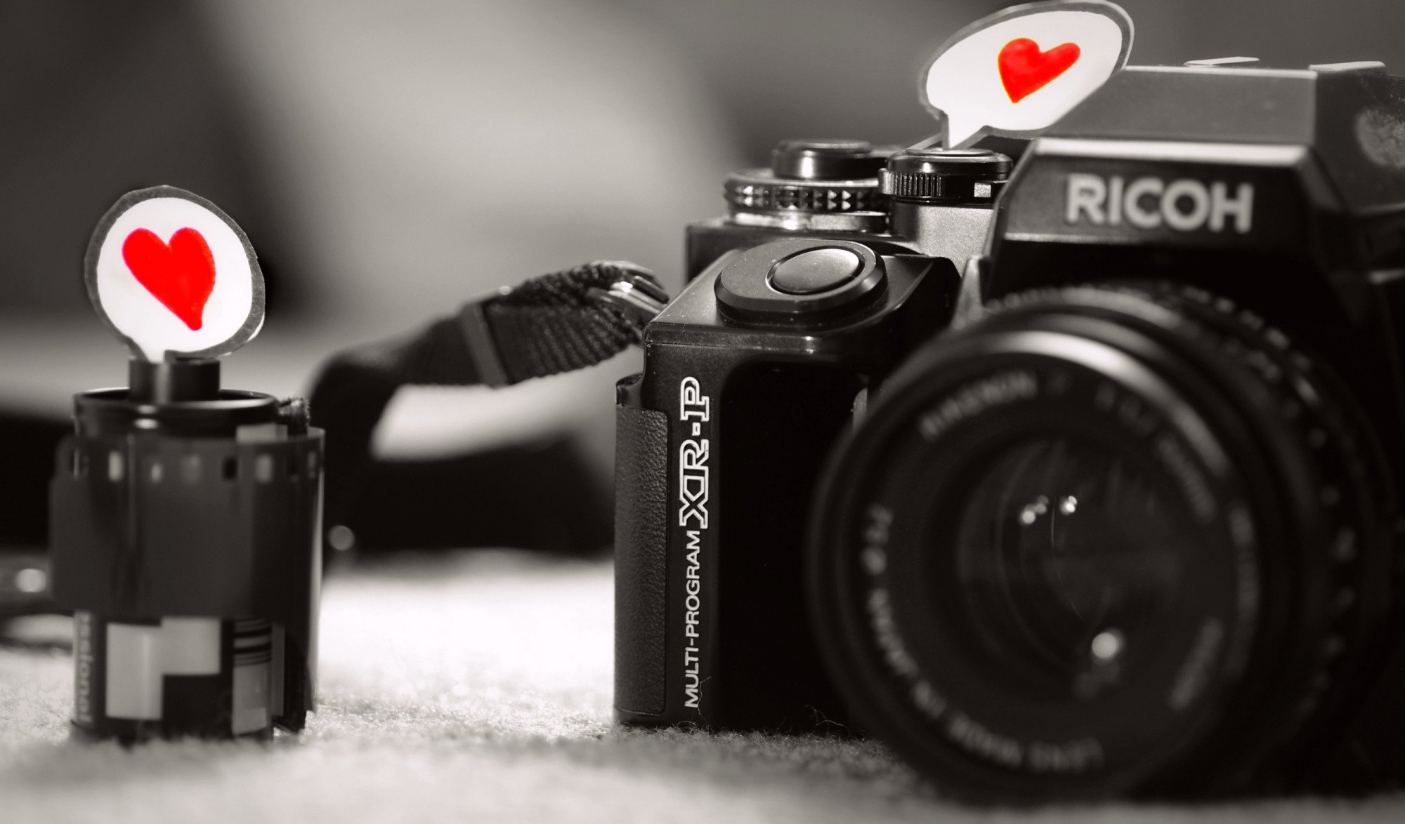 macro love heart love feeling paper black and white camera camera lens gray background film photo equipment photo