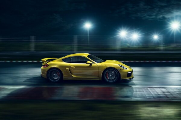 Yellow Porsche Cayenne supercar on the track