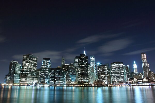 Night metropolis on the background of the starry sky