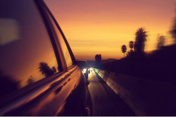 Night traffic jam on the highway at sunset