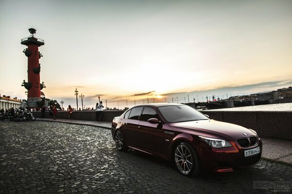 Cherry BMW in the sunset in St. Petersburg