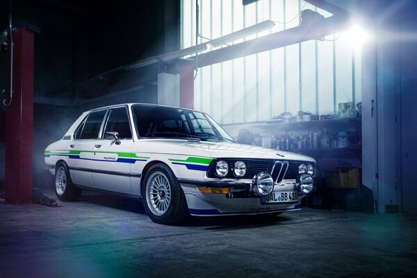 Bmw white in a bright garage