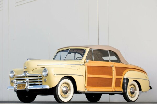 Retro car of 1948 on a light background