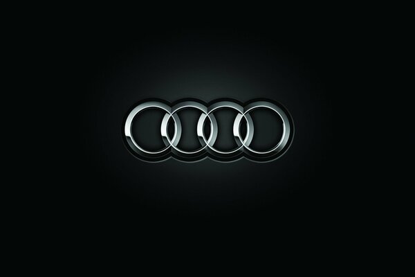 Emblema de Audi sobre fondo negro