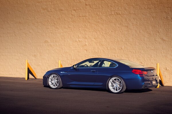 Blue BMW on an orange background