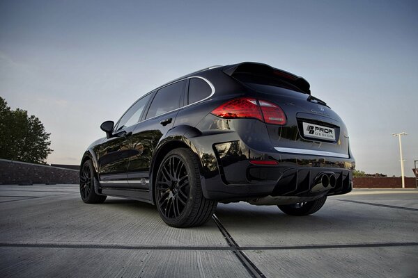 Cayenne Porsche on the road against the sky