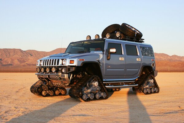 Silver Hummer all-terrain vehicle in the desert