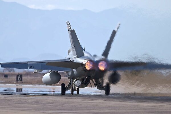 A military plane is on the runway