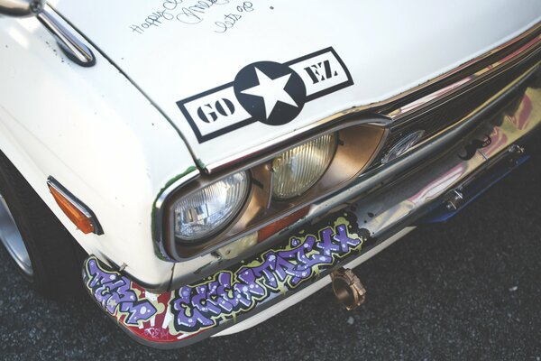 A white star in a black circle on the hood of the car