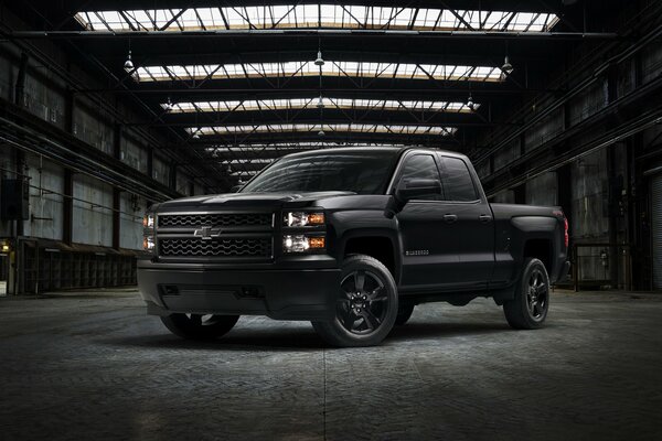 Black brutal Chevrolet pickup truck sideways