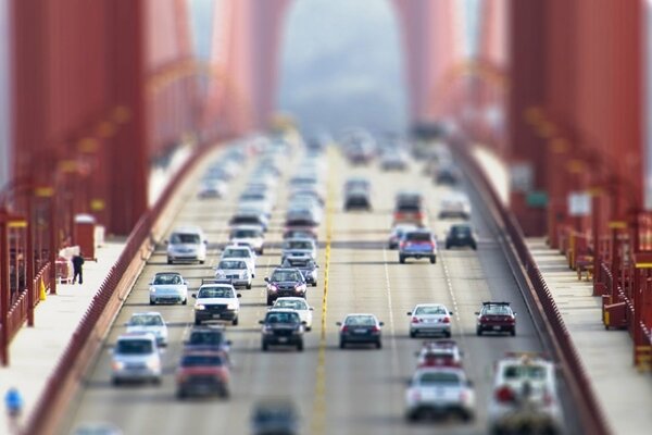 Cars of different models move on the bridge