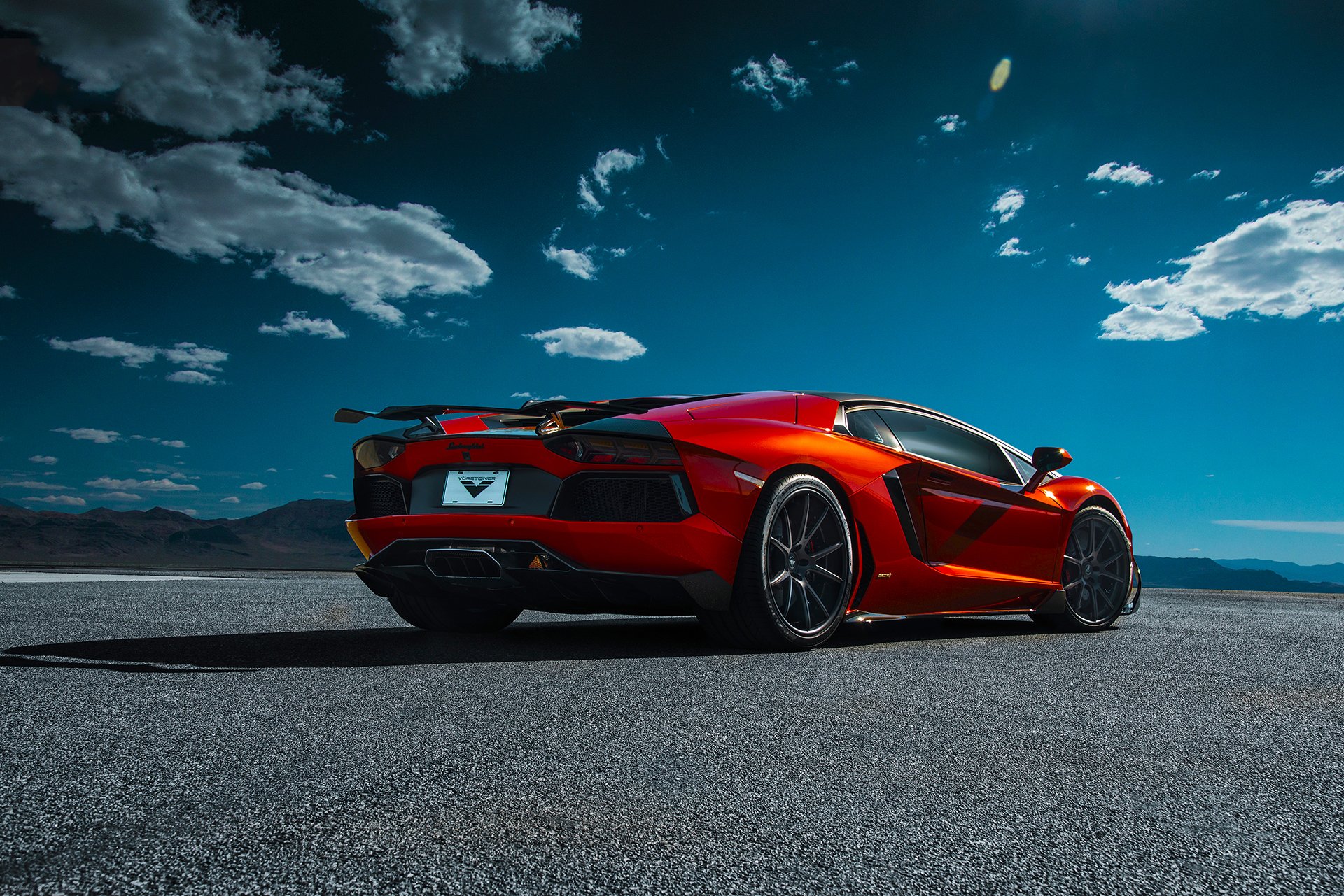 lamborghini aventador-v lp740-4 saragozza vorsteiner supercar arancione posteriore deserto cielo nuvole