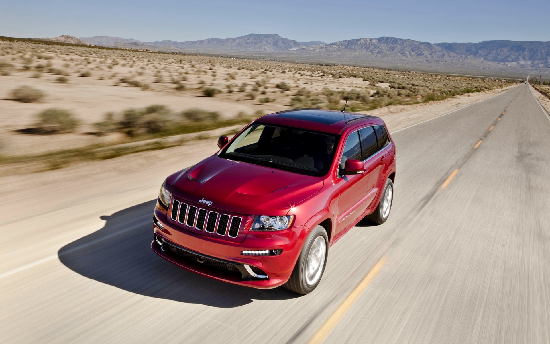 jeep grand cherokee przód czerwony droga dzień w ruchu samochód suv