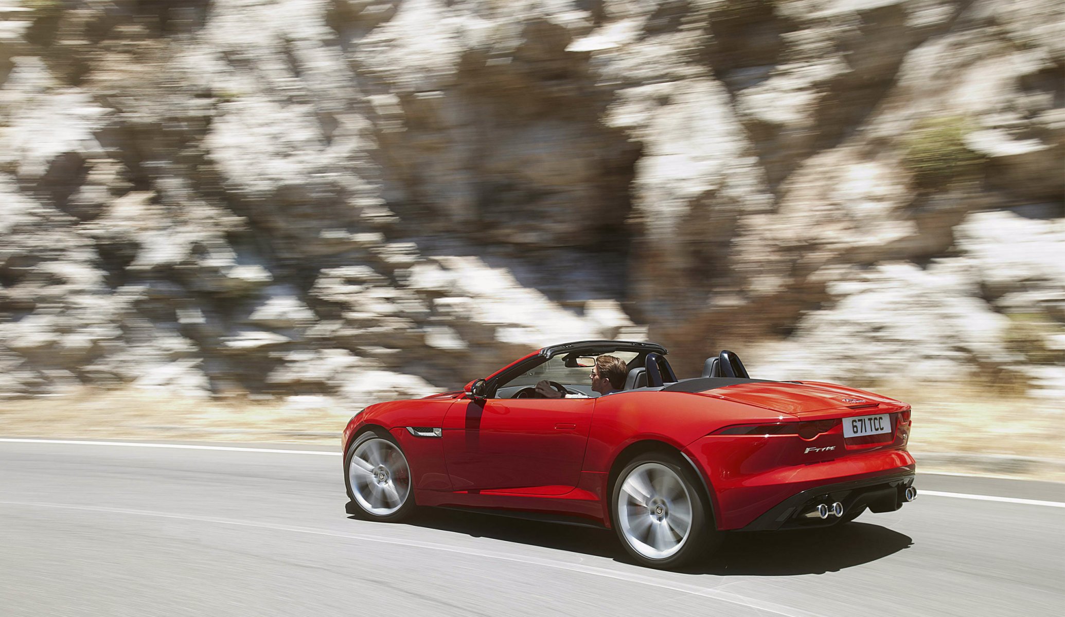 jaguar f-type jaguar vue latérale rouge convertible mouvement tourner