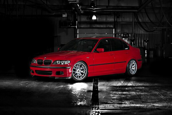 Car. Red BMW on a rainy evening